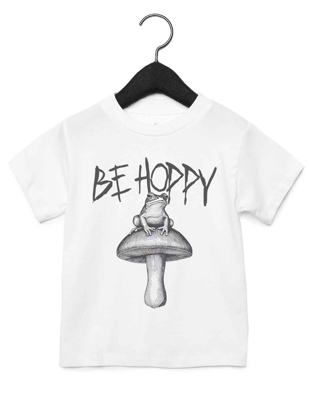 Toddler t-shirt featuring a funny illustrated animal design of a magical frog on a mushroom – playful and cool kids tee with bold nature-inspired graphic, perfect for adventurous toddlers, unique kids gift or trendy preschool outfit.