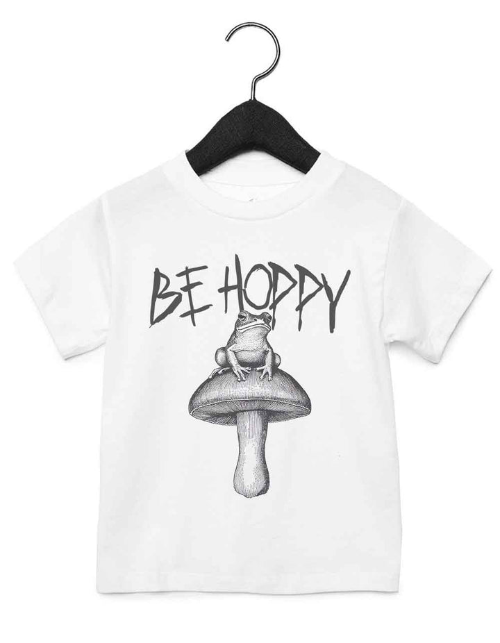 Toddler t-shirt featuring a funny illustrated animal design of a magical frog on a mushroom – playful and cool kids tee with bold nature-inspired graphic, perfect for adventurous toddlers, unique kids gift or trendy preschool outfit.