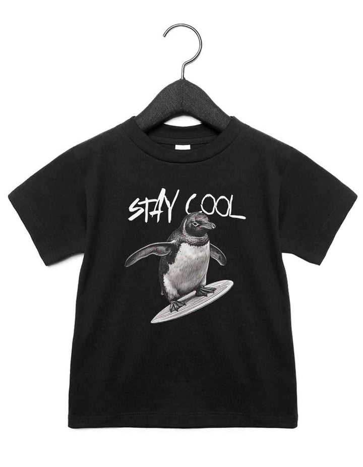 Toddler t-shirt featuring a funny illustrated animal design of a surfing penguin – playful and cool kids tee with bold nature-inspired graphic, perfect for adventurous toddlers, unique kids gift or trendy preschool outfit.